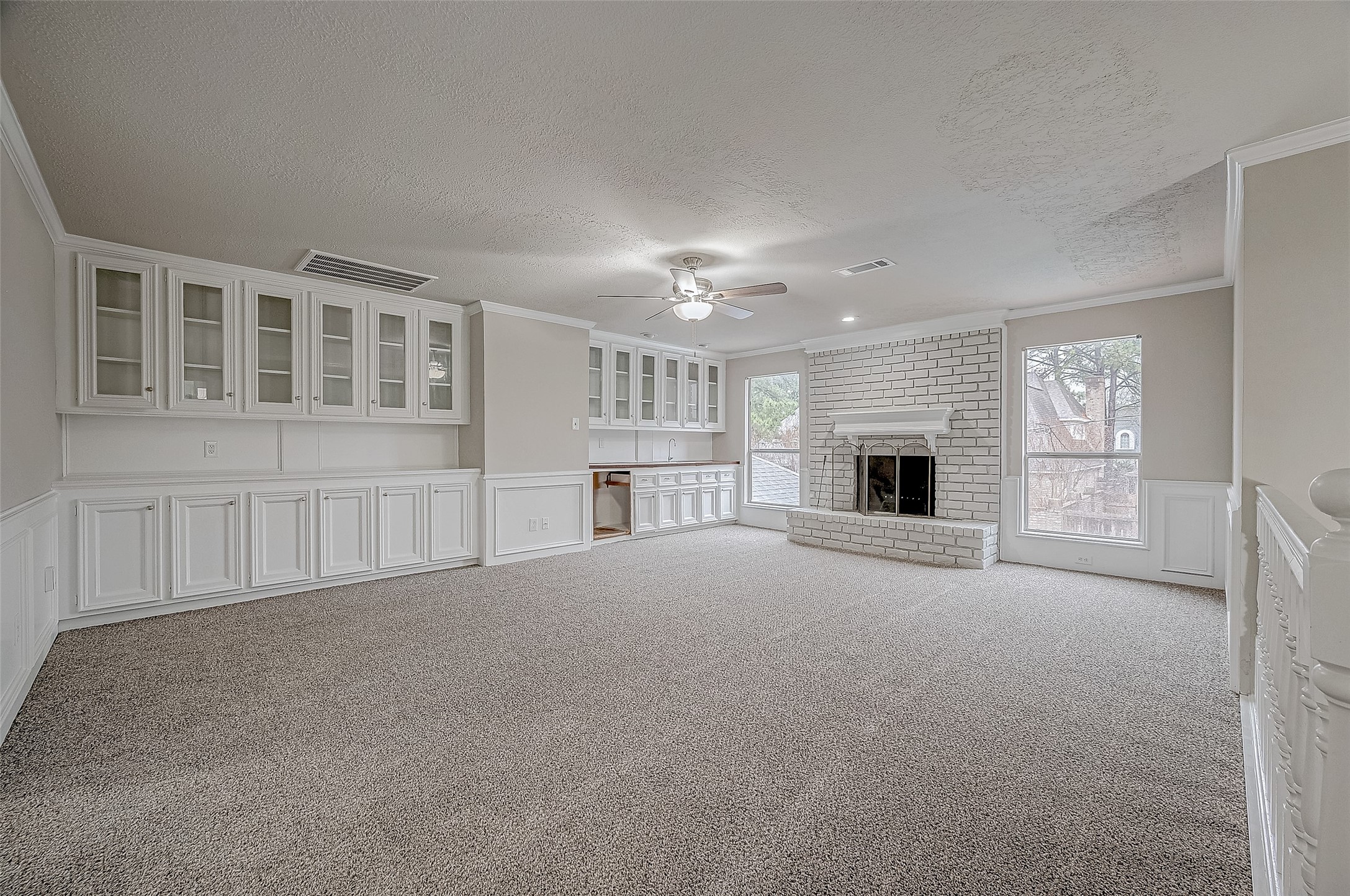 4218 Bayglen Court Houston, TX 77068 - Photo 20 of 42 a view of an empty room with a fireplace and a window