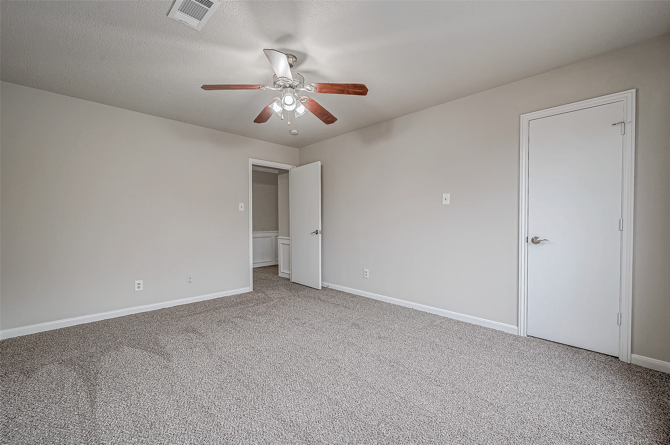 4218 Bayglen Court Houston, TX 77068 - Photo 26 of 42 a view of an empty room with a fan