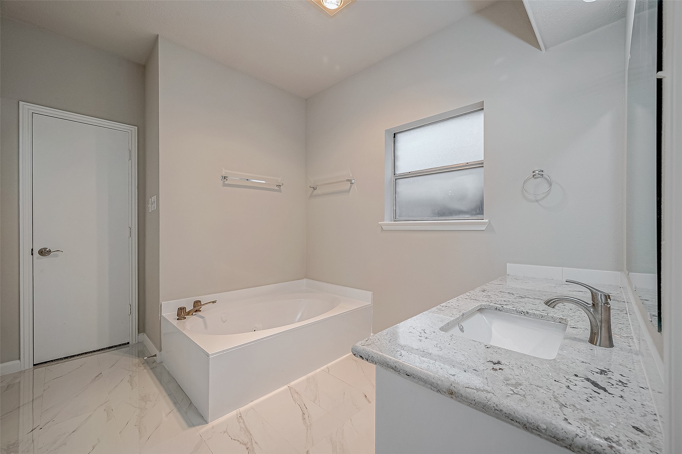 4218 Bayglen Court Houston, TX 77068 - Photo 35 of 42 a bathroom with a sink and a bathtub