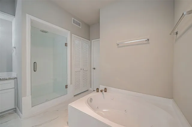 a white bath tub sitting in a bathroom