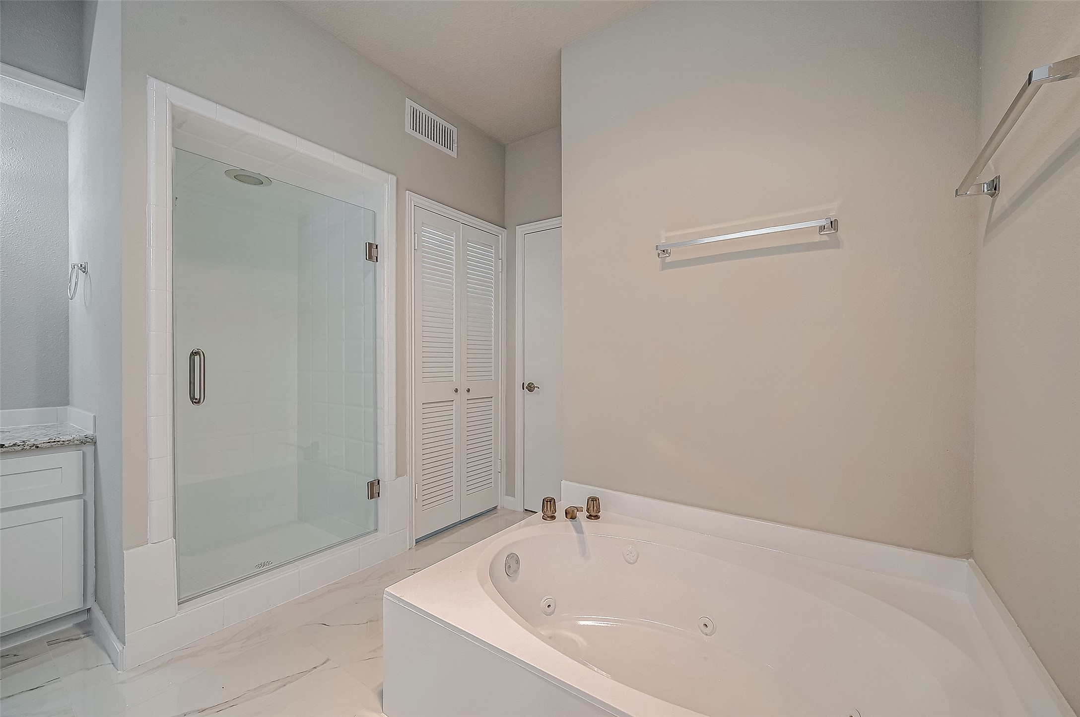 4218 Bayglen Court Houston, TX 77068 - Photo 36 of 42 a white bath tub sitting in a bathroom