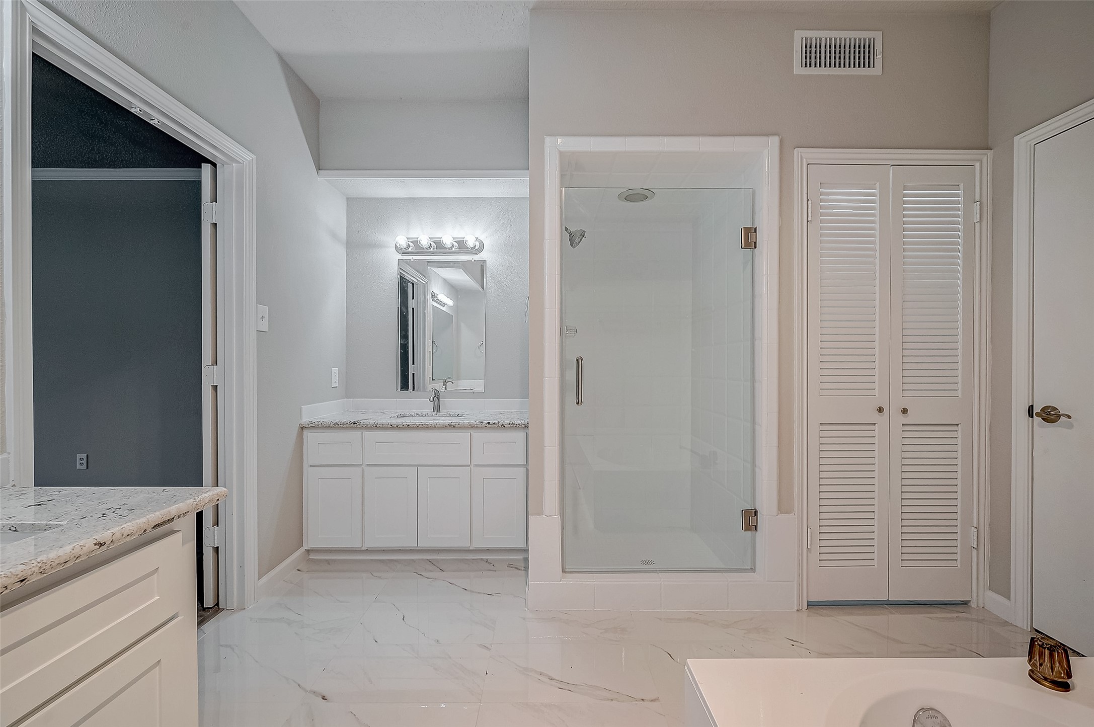4218 Bayglen Court Houston, TX 77068 - Photo 37 of 42 a bathroom with a granite countertop sink and a mirror