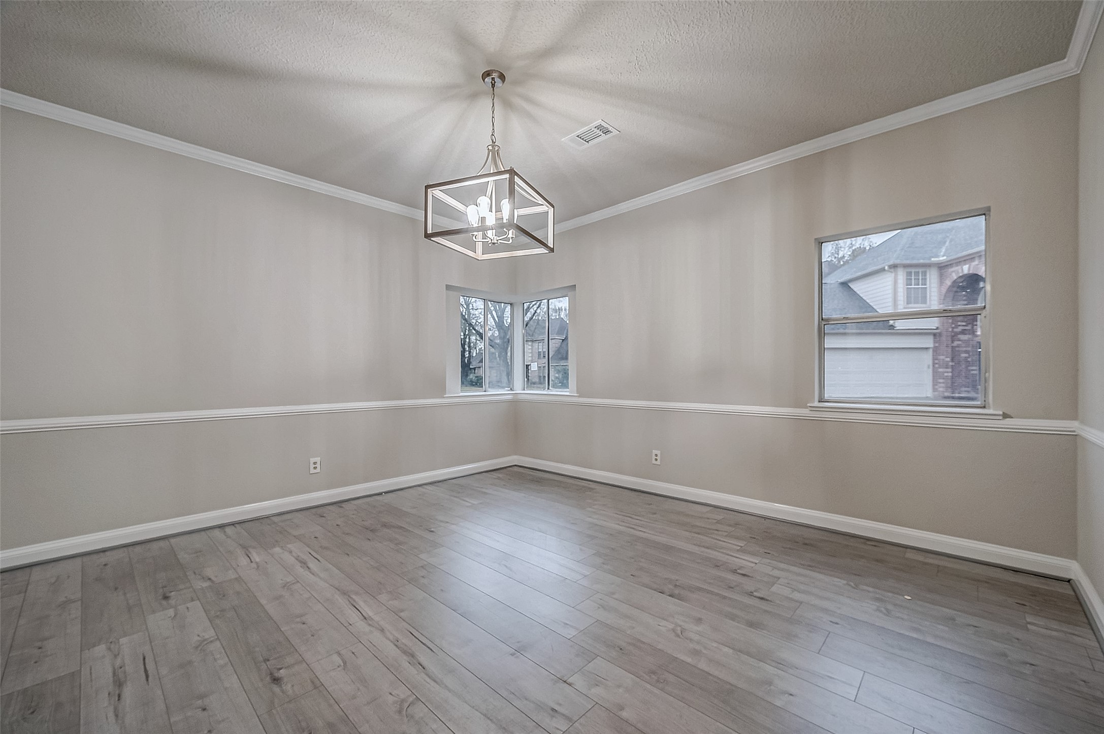 4218 Bayglen Court Houston, TX 77068 - Photo 6 of 42 wooden floor in an empty room with a window