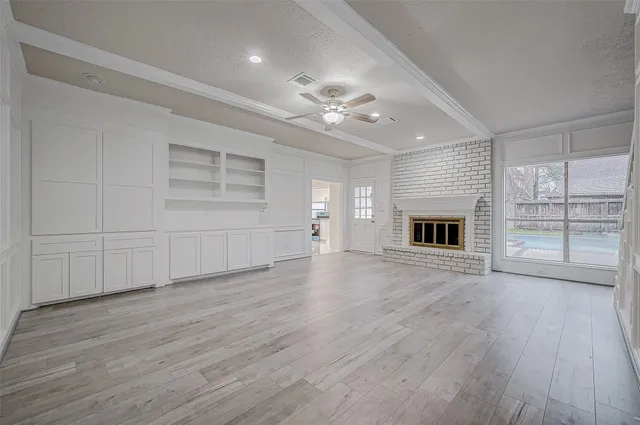 a view of livingroom with hardwood floor and a ceiling fan