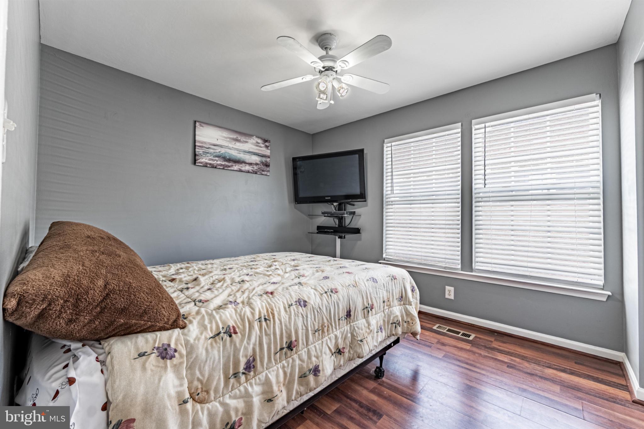 60 6 Point Court Baltimore, MD 21244 - Photo 15 of 28 a bedroom with a bed and a chandelier