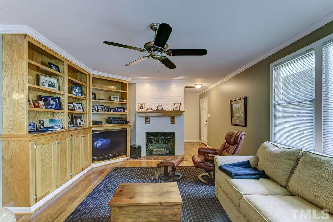 3432 Leonard Street Raleigh, NC 27607 - Photo 3 of 25 a living room with furniture fireplace and flat screen tv