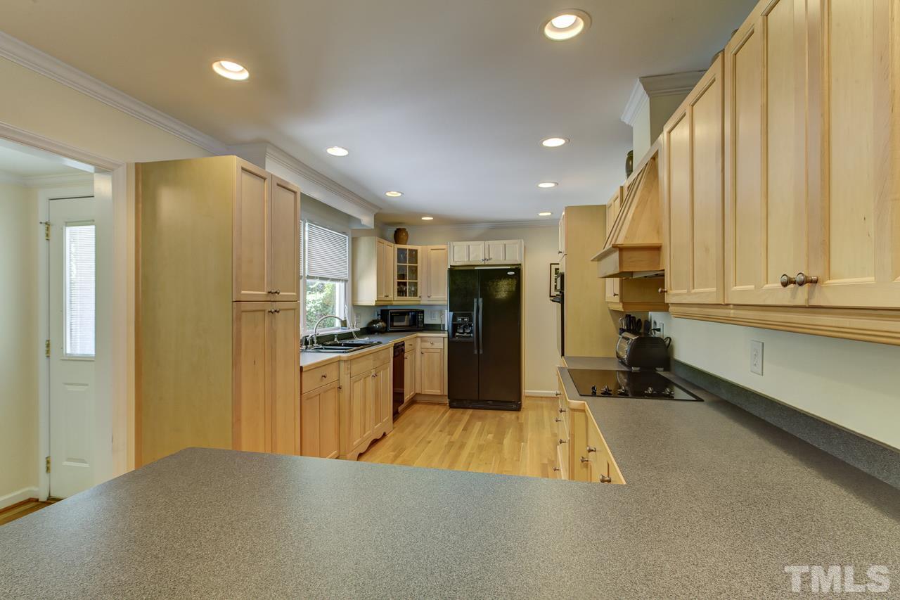 3432 Leonard Street Raleigh, NC 27607 - Photo 8 of 25 a kitchen with refrigerator and window