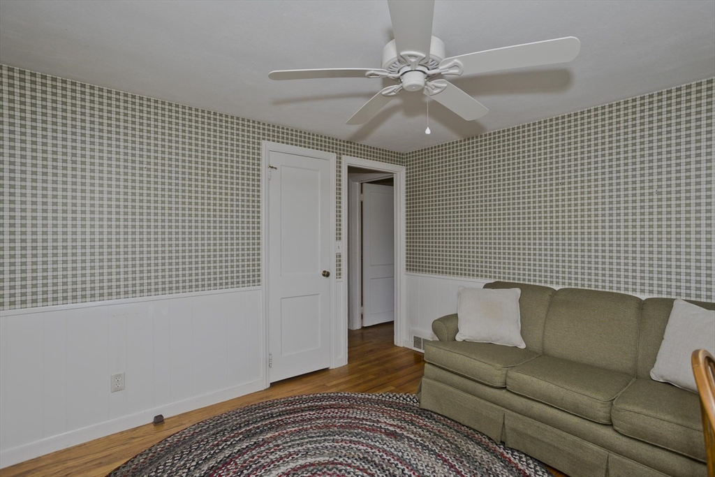 54 Mohawk Drive Springfield, MA 01129 - Photo 11 of 35 a living room with furniture and a ceiling fan