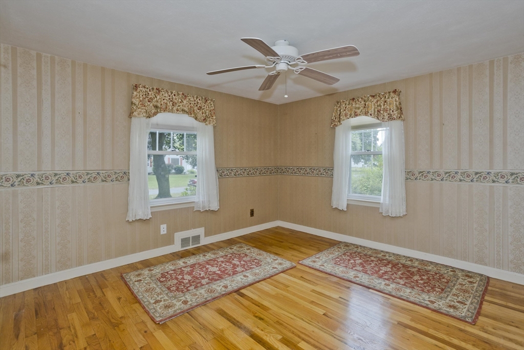 54 Mohawk Drive Springfield, MA 01129 - Photo 12 of 35 a view of an empty room with window and wooden floor