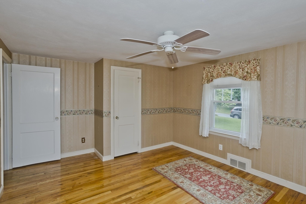 54 Mohawk Drive Springfield, MA 01129 - Photo 13 of 35 a view of an empty room with window and wooden floor