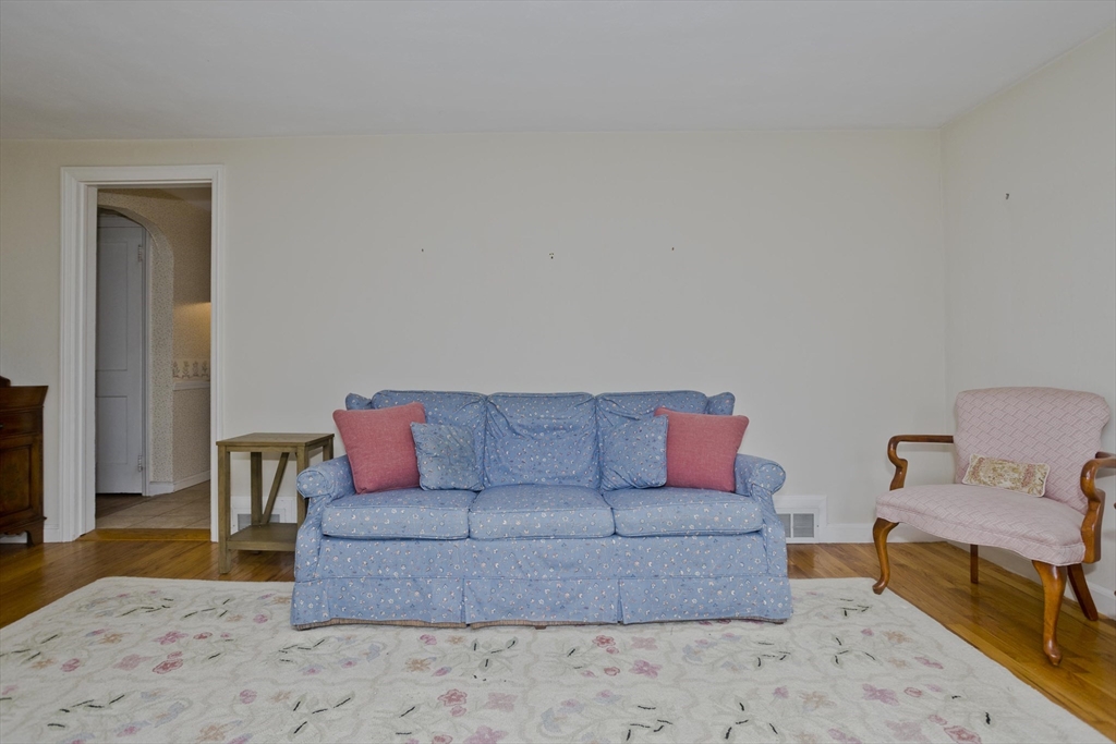 54 Mohawk Drive Springfield, MA 01129 - Photo 18 of 35 a living room with furniture and a wooden floor