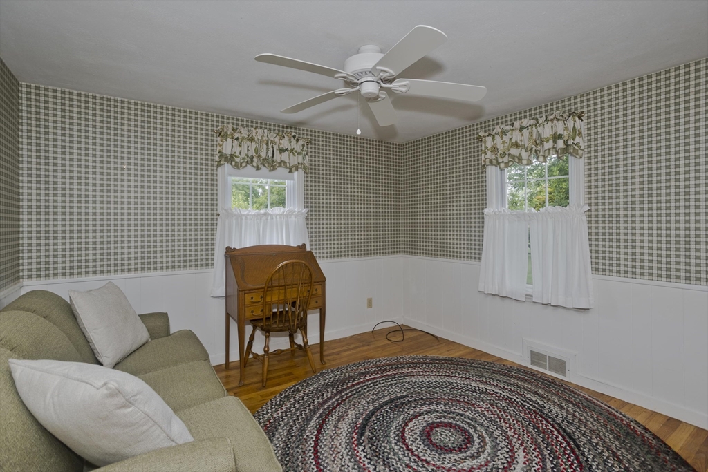 54 Mohawk Drive Springfield, MA 01129 - Photo 9 of 35 a living room with furniture and a chandelier