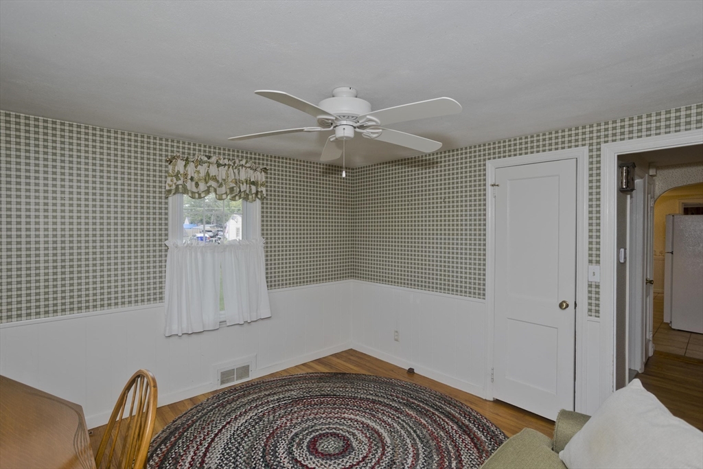 54 Mohawk Drive Springfield, MA 01129 - Photo 10 of 35 a bedroom with a bed and a chandelier