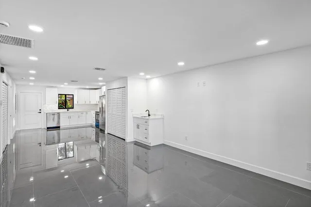 a bathroom with a shower a toilet and sink