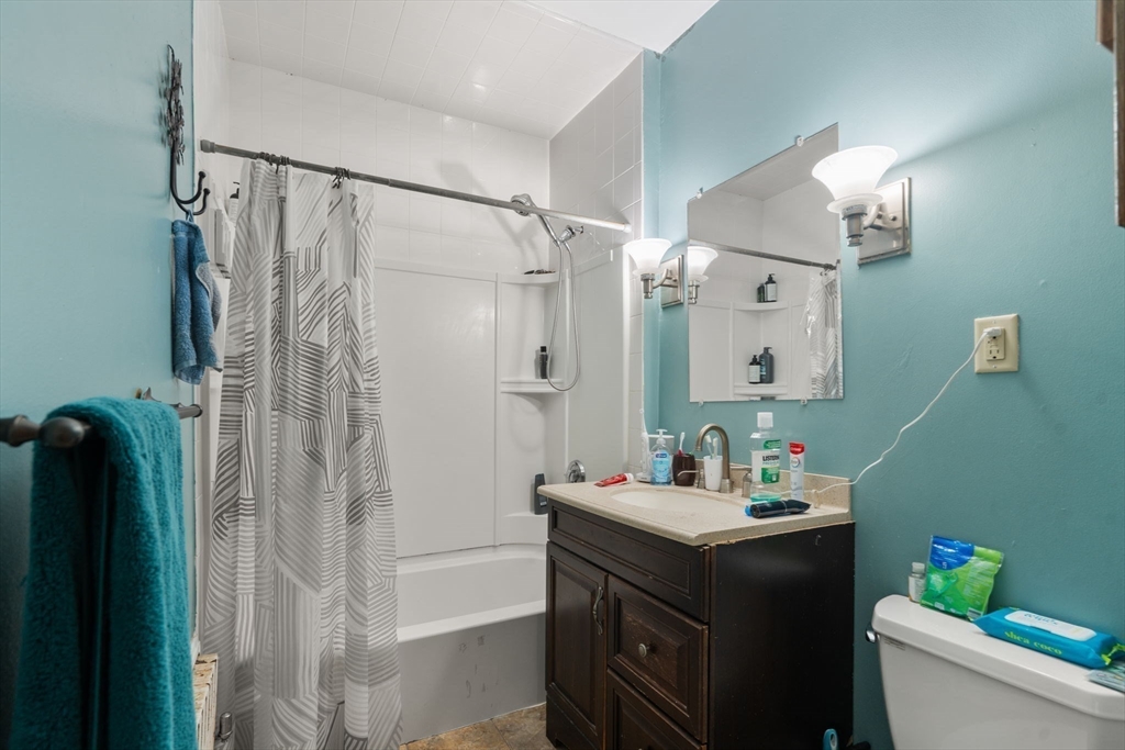 5 Bay State Road Worcester, MA 01606 - Photo 8 of 21 a bathroom with a sink mirror and a shower