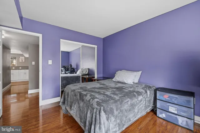 a bathroom with a sink and a glass door shower