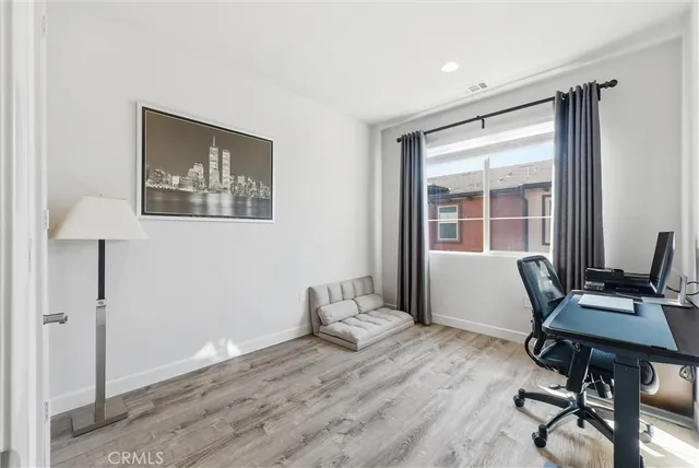 a workspace with furniture and a window