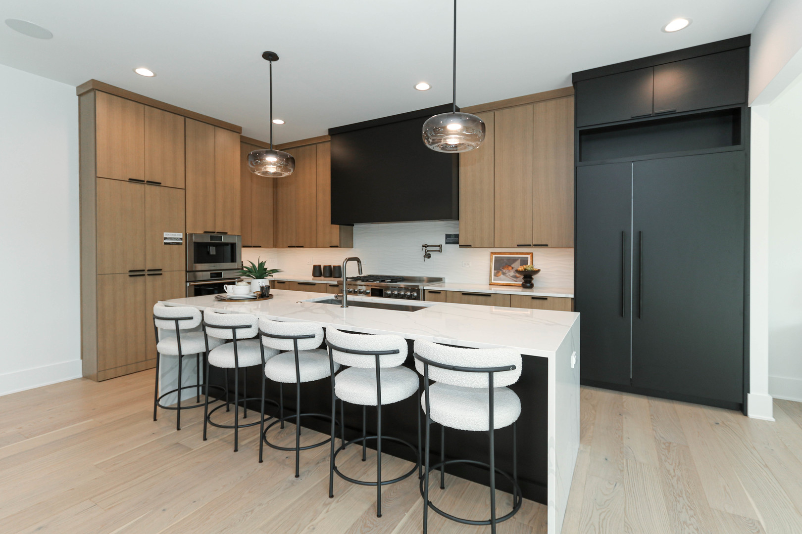 3316 Club Court Naperville, IL 60564 - Photo 8 of 26 a kitchen with kitchen island granite countertop a sink a center island and cabinets