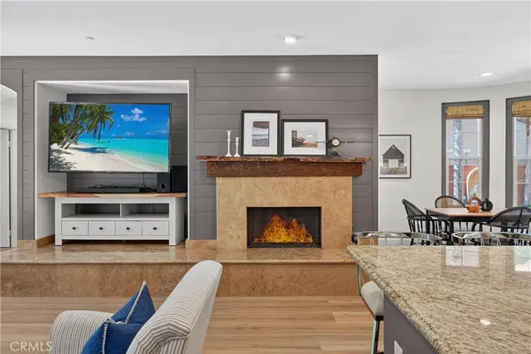 a bedroom with a bed and a large mirror