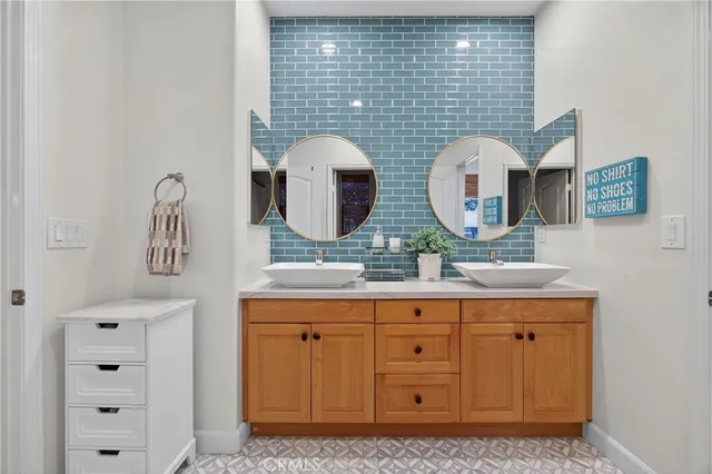 a kitchen with a sink a stove and cabinets