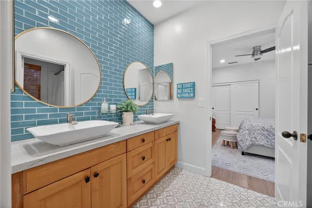 a view of a patio with couches and a table and chairs with wooden floor