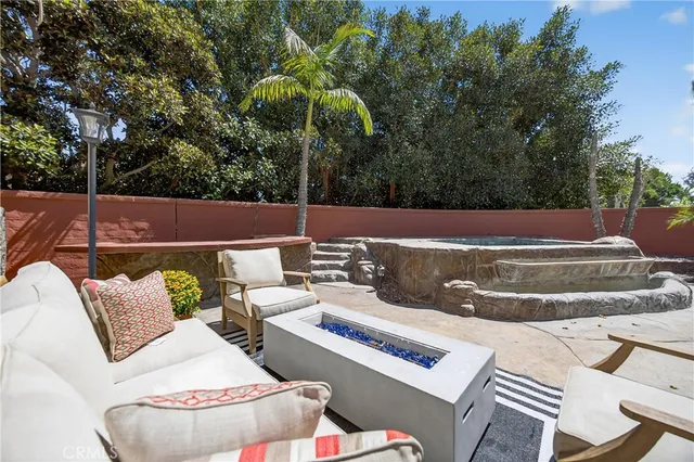 an aerial view of green landscape with trees houses and mountain view