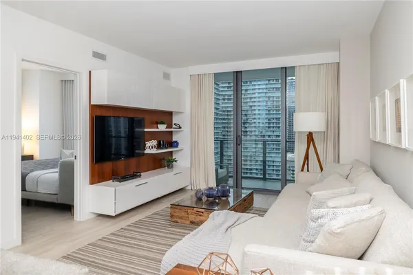 a living room with furniture and a window