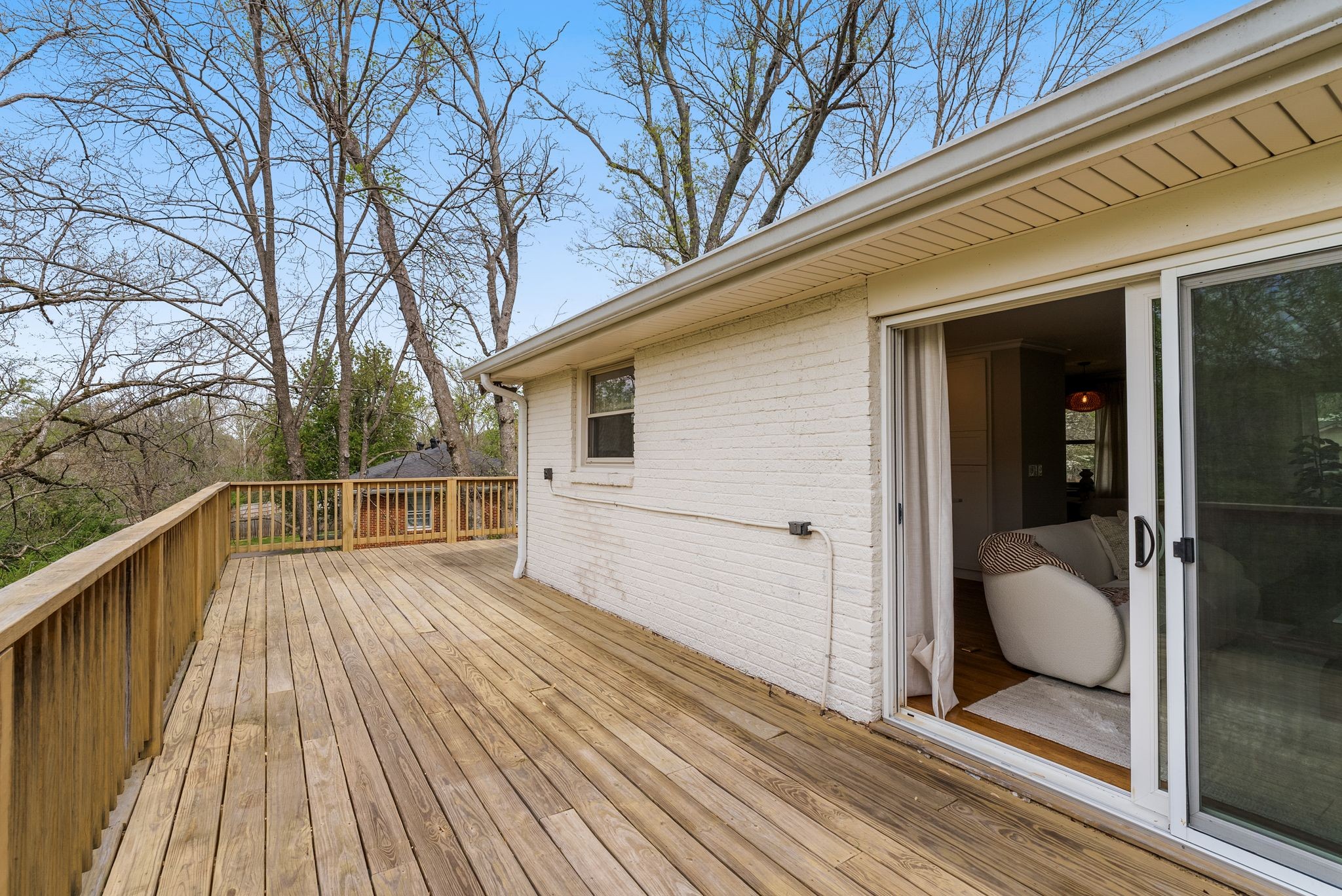 1217 A Davidson Road Nashville, TN 37205 - Photo 28 of 29 a view of a balcony with wooden floor and floor to ceiling window