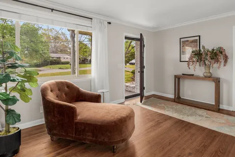 a living room with furniture and a large window