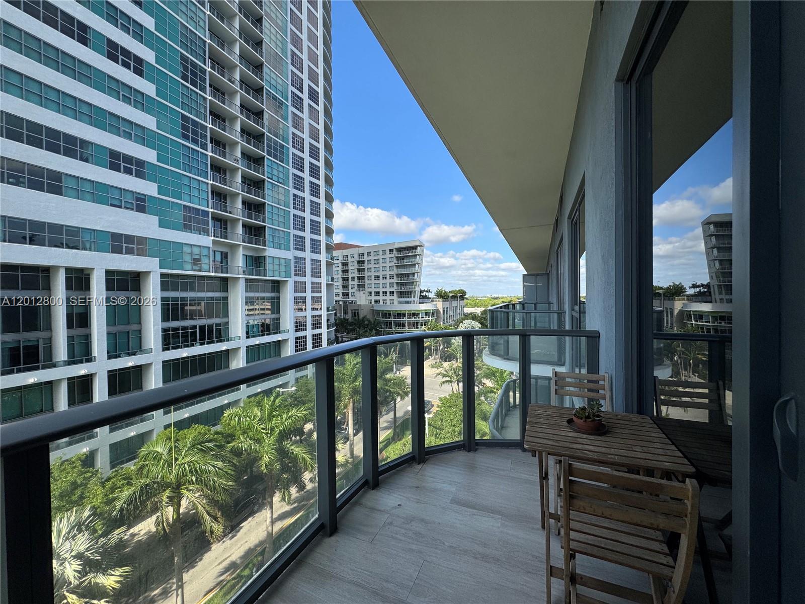 121 Northeast 34th Street, Unit L601 Miami, FL 33137 - Photo 1 of 32 a balcony with an outdoor space