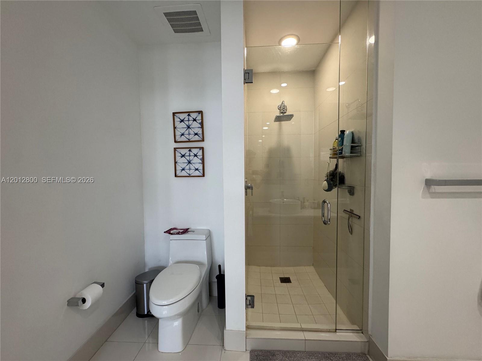 121 Northeast 34th Street, Unit L601 Miami, FL 33137 - Photo 12 of 32 a bathroom with a toilet and a shower