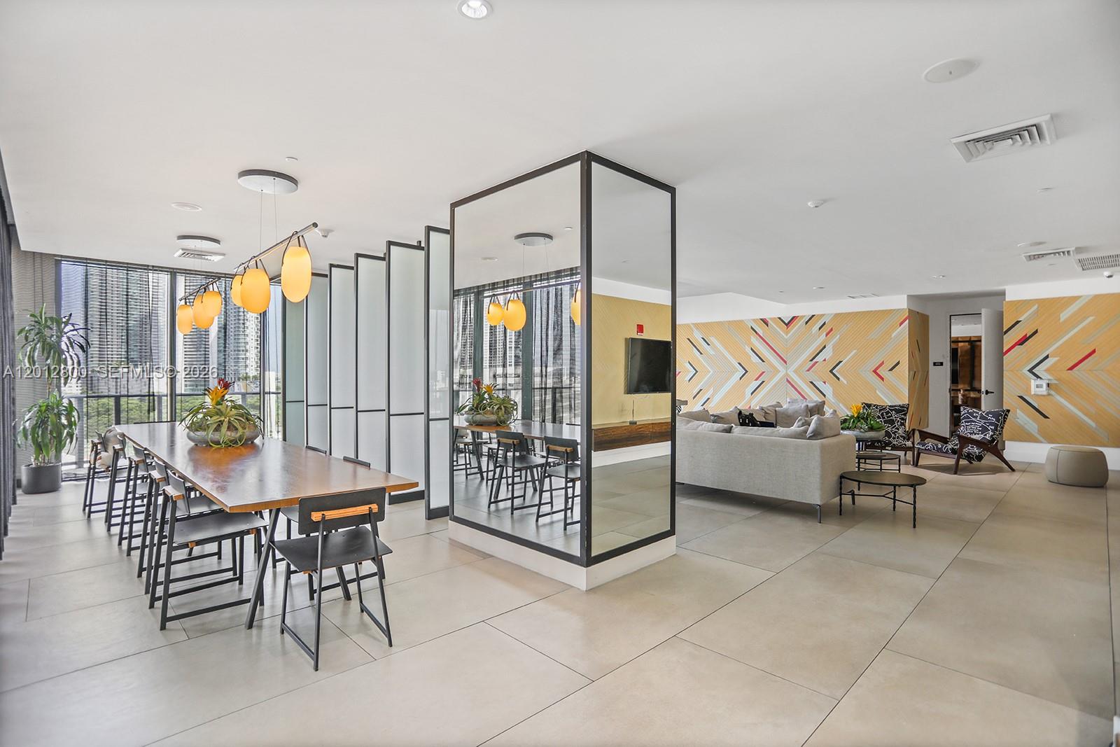 121 Northeast 34th Street, Unit L601 Miami, FL 33137 - Photo 23 of 32 a outdoor space with lots of tables and chairs