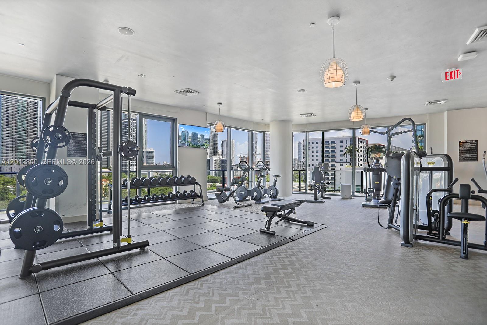 121 Northeast 34th Street, Unit L601 Miami, FL 33137 - Photo 24 of 32 a view of a room with gym equipment