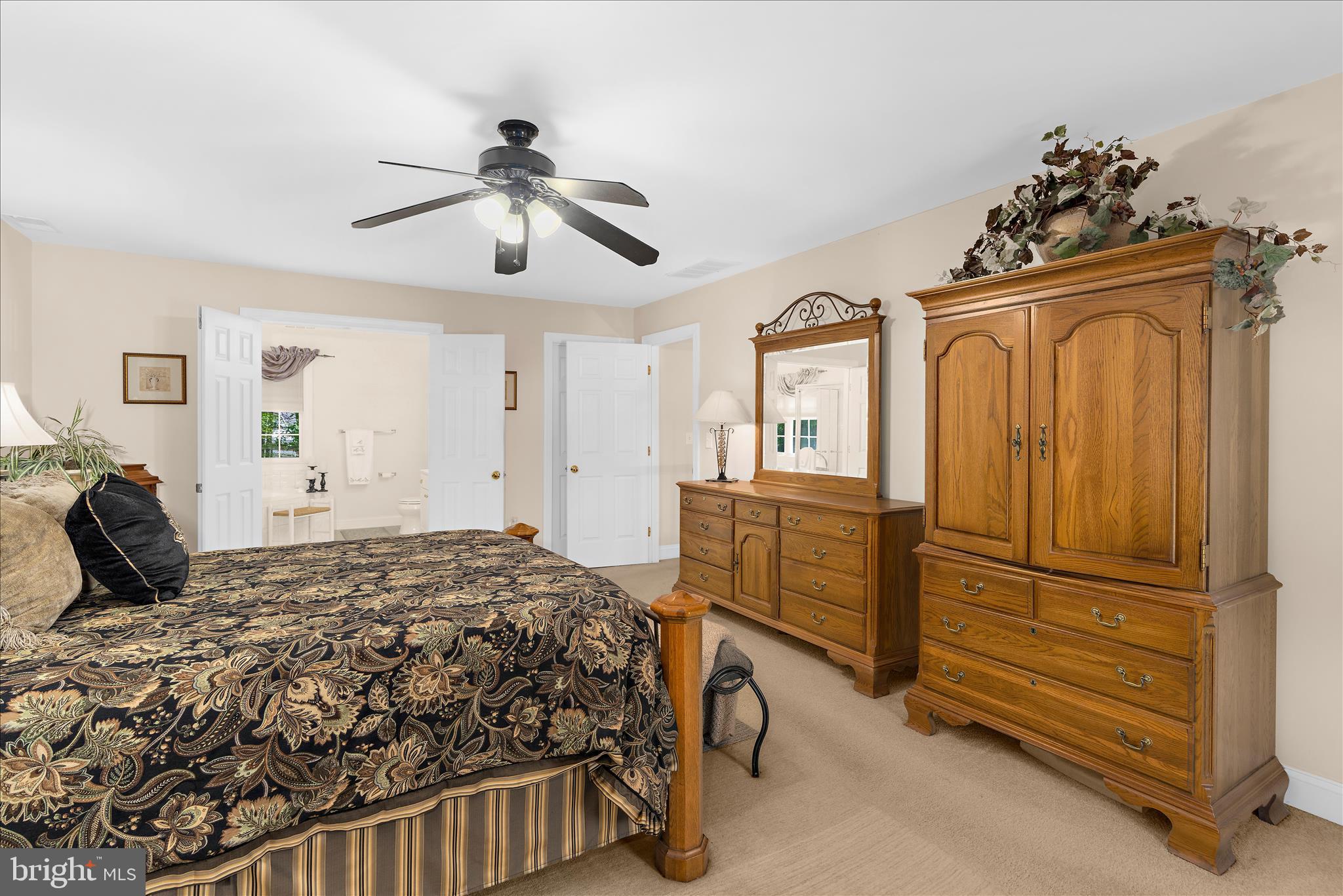 1848 Cherry Road Annapolis, MD 21409 - Photo 30 of 57 a bedroom with a bed and a chandelier