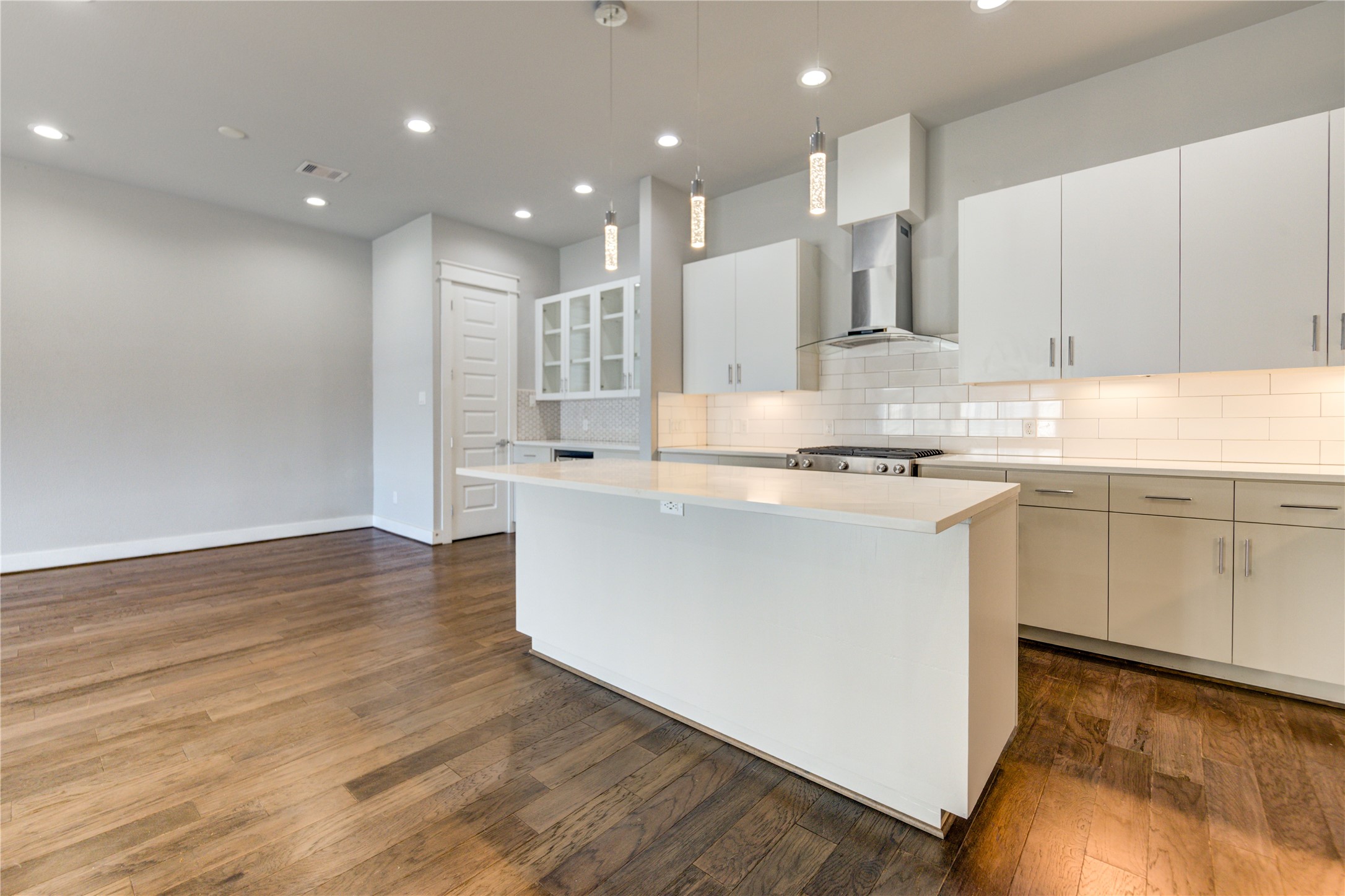 3306 Cline Street Houston, TX 77020 - Photo 11 of 30 a kitchen with kitchen island sink stove and white cabinets