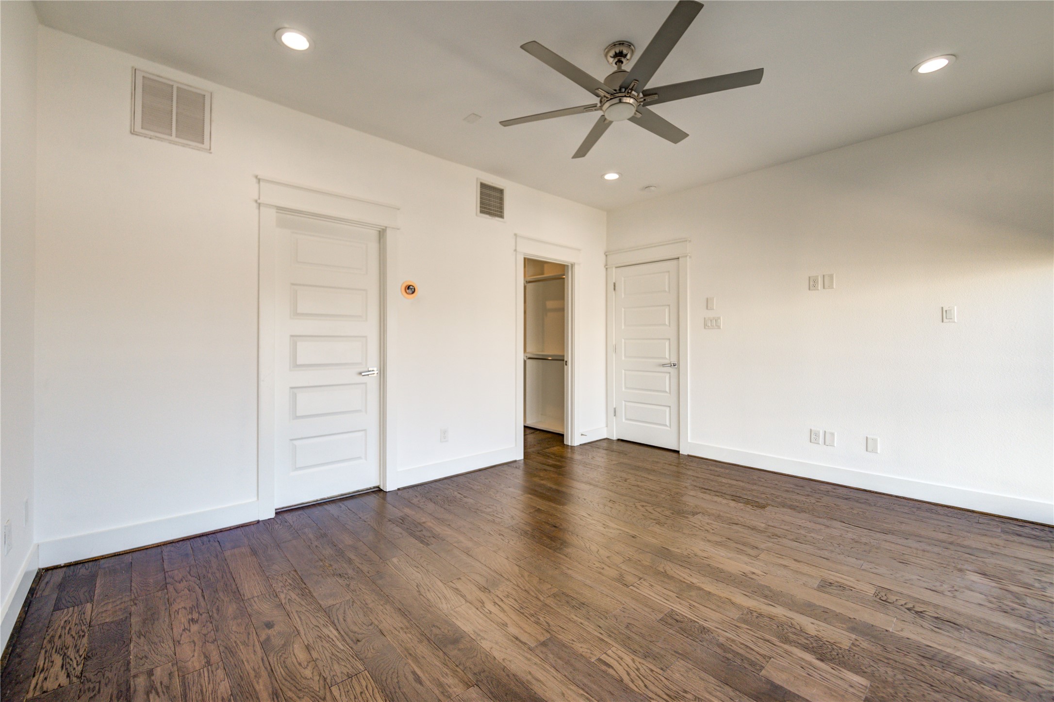 3306 Cline Street Houston, TX 77020 - Photo 15 of 30 an empty room with wooden floor and windows