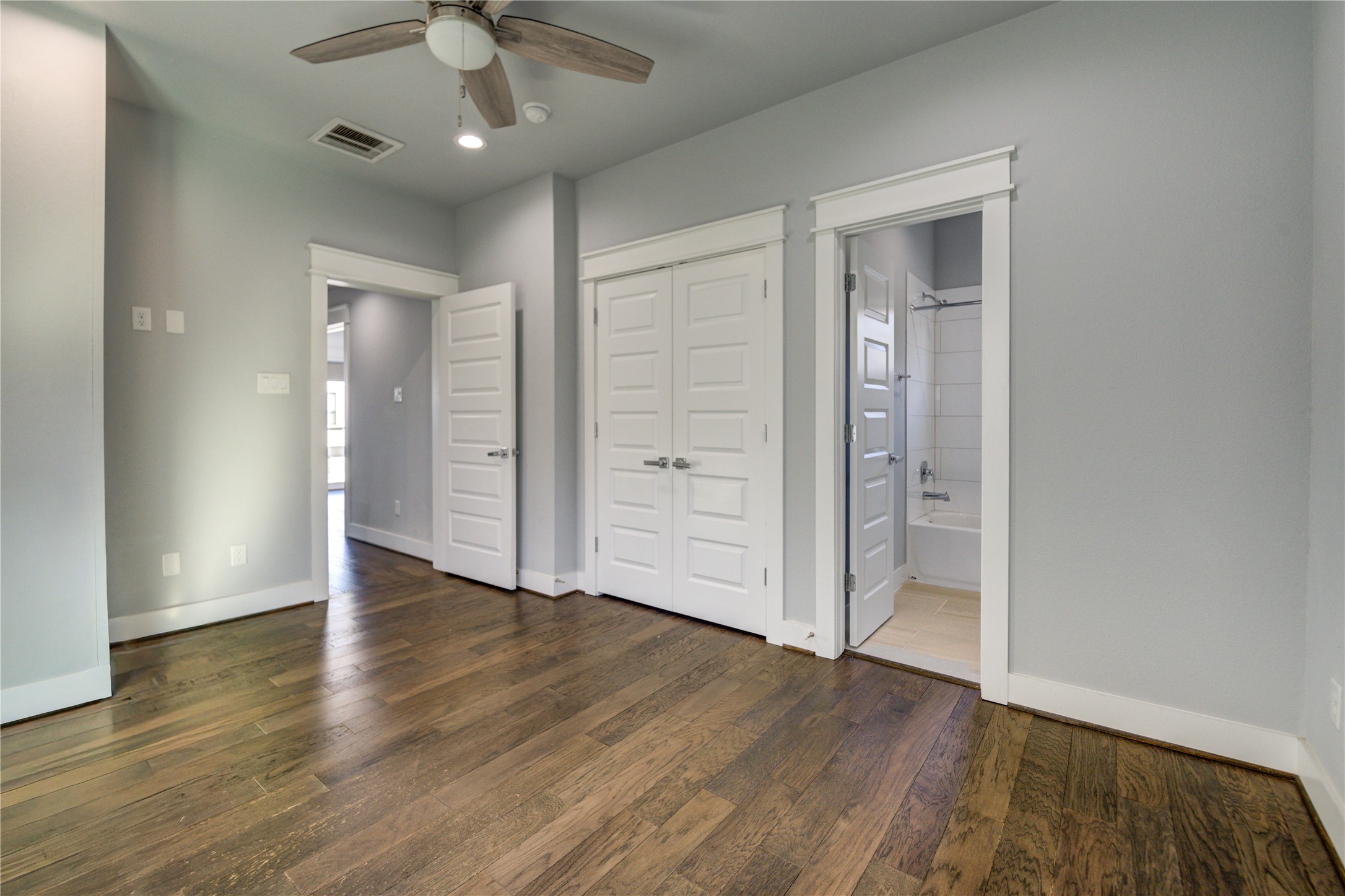 3306 Cline Street Houston, TX 77020 - Photo 24 of 30 an empty room with wooden floor cabinet and windows
