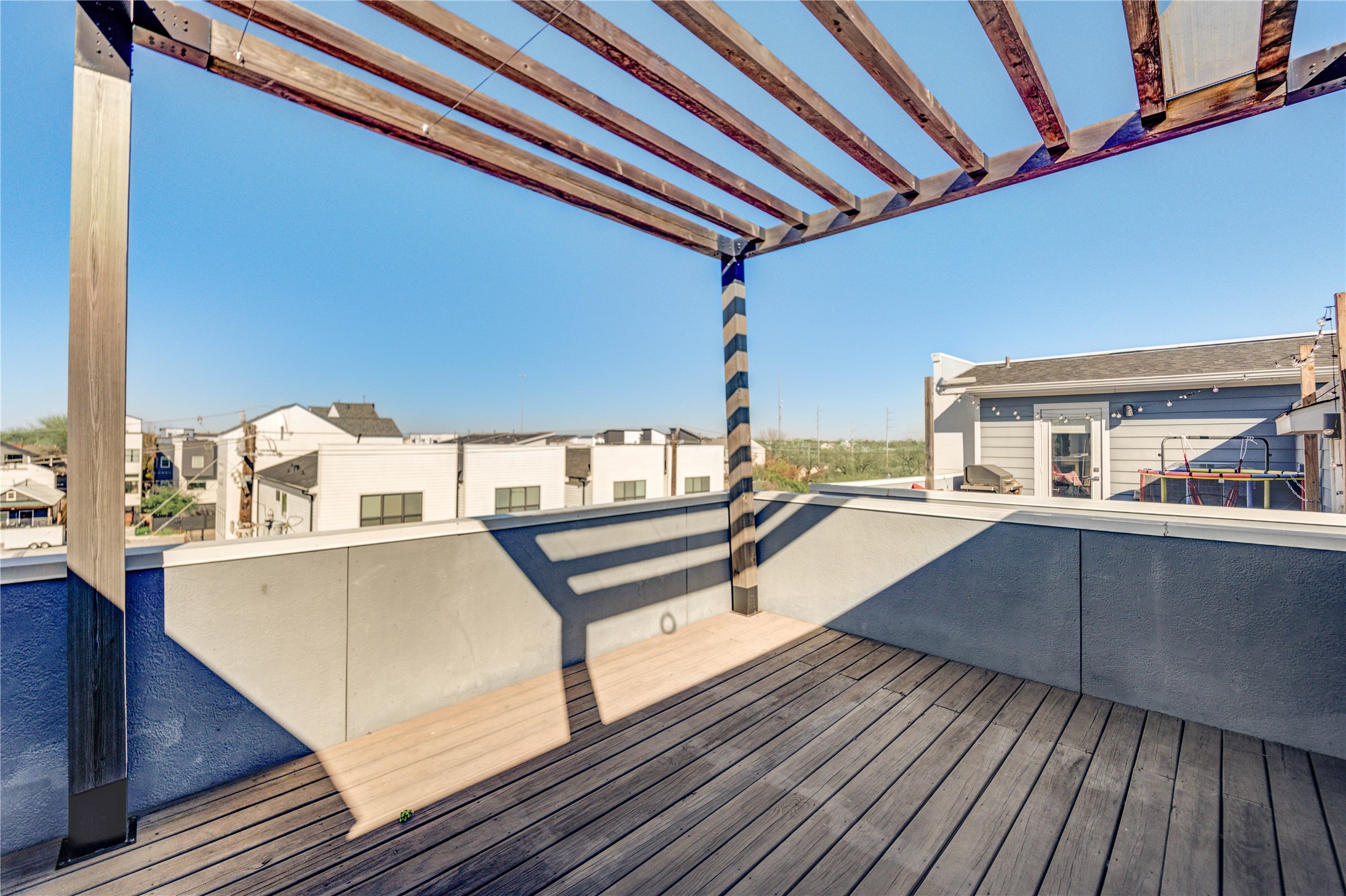 3306 Cline Street Houston, TX 77020 - Photo 3 of 30 a view of a balcony with chairs and wooden floor