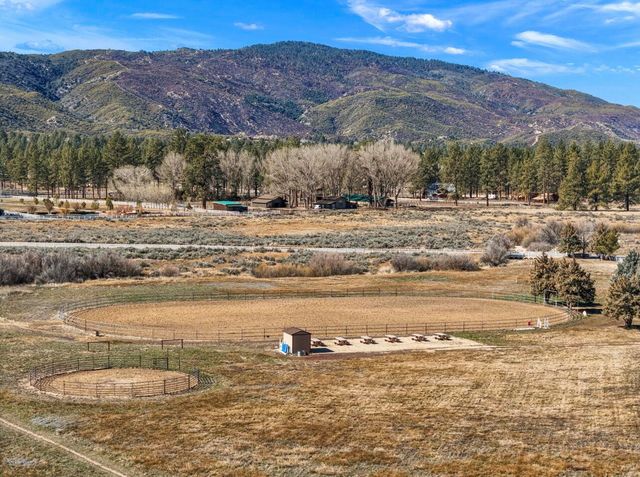 an aerial view of a houses with a road