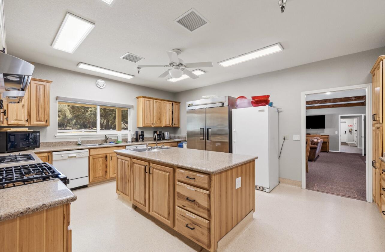 0 Chimney Rock Court Mountain Center, CA 92561 - Photo 22 of 24 a kitchen with a stove a refrigerator and a sink
