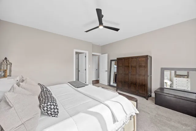 a bedroom with a bed and a dresser