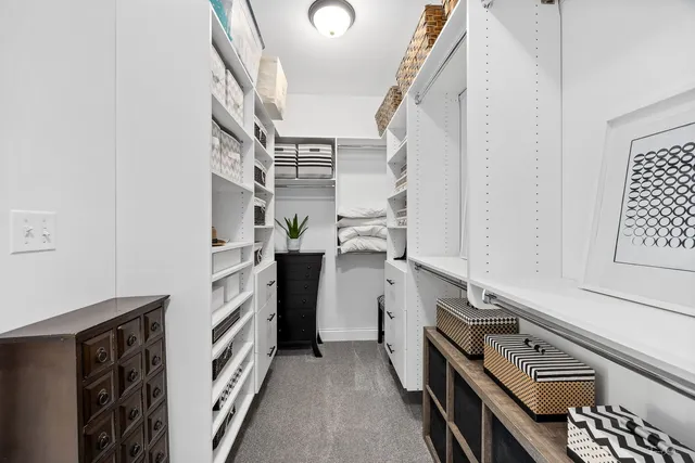 a view of storage and utility room with racks on the wall