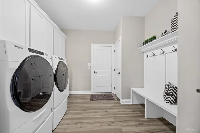 a view of a hallway with washer and dryer