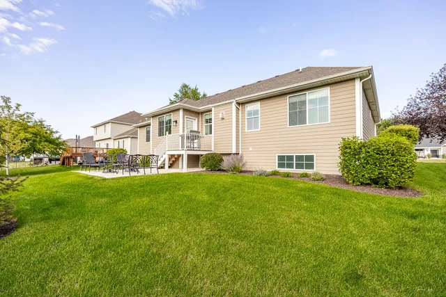 a view of a house with a backyard