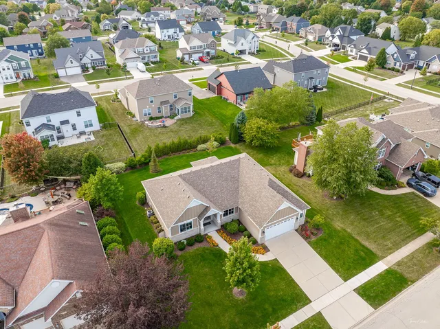 an aerial view of residential houses with outdoor space