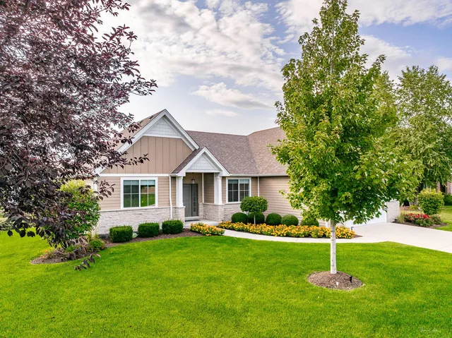 a house that is sitting in the grass