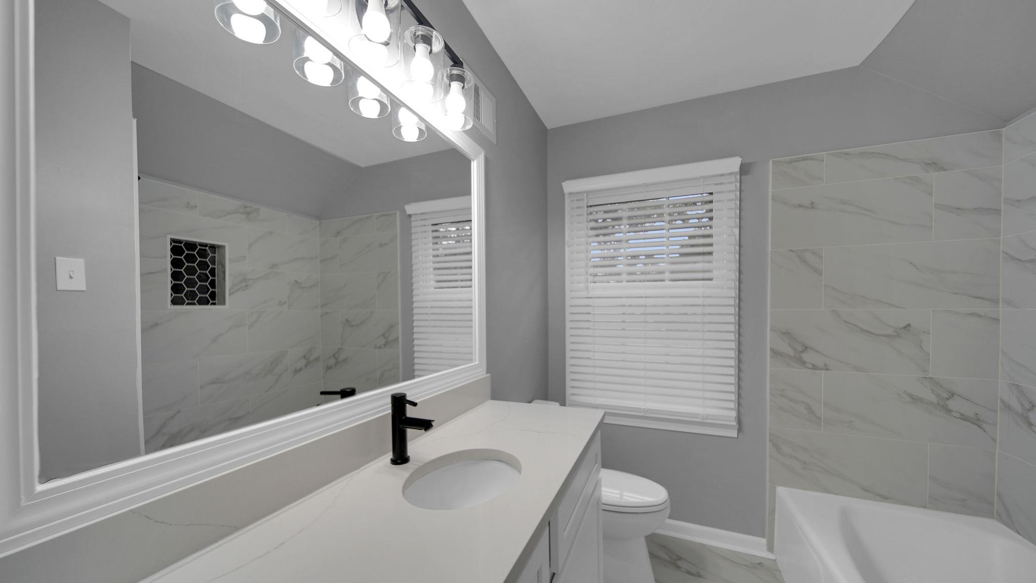 5256 Collingwood Road Memphis, TN 38117 - Photo 31 of 40 Full bathroom featuring light marble finish flooring and vanity