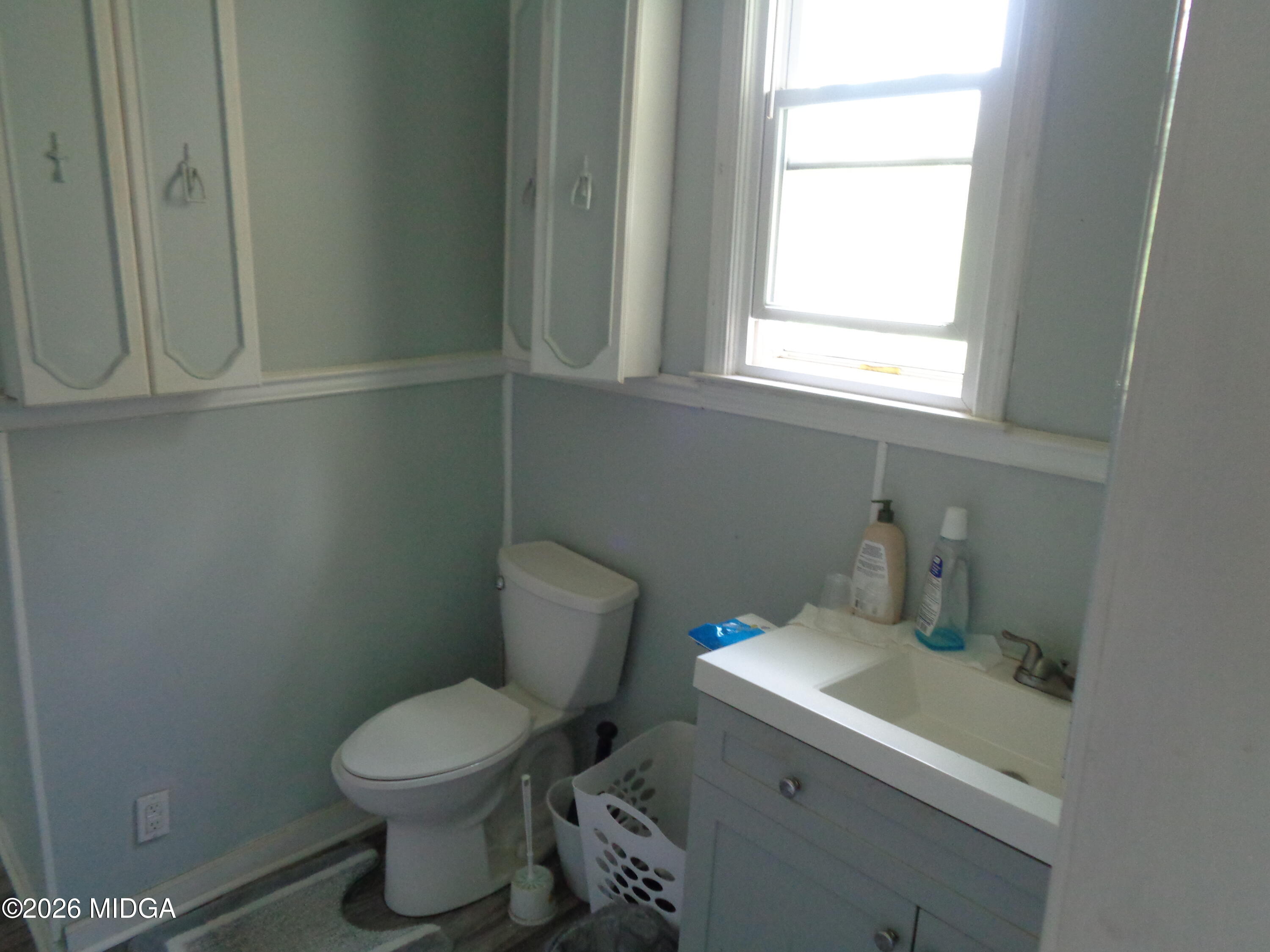 3380 Goodwin Lane Macon, GA 31217 - Photo 12 of 22 a bathroom with a toilet sink and window