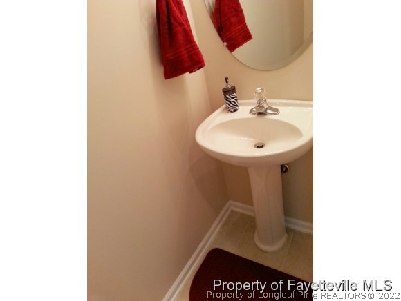 75 Holly Oak Circle Bunnlevel, NC 28323 - Photo 11 of 25 a bathroom with a sink and a mirror