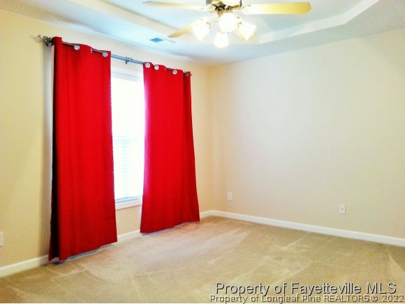 75 Holly Oak Circle Bunnlevel, NC 28323 - Photo 12 of 25 a view of a room with a chandelier fan and closet